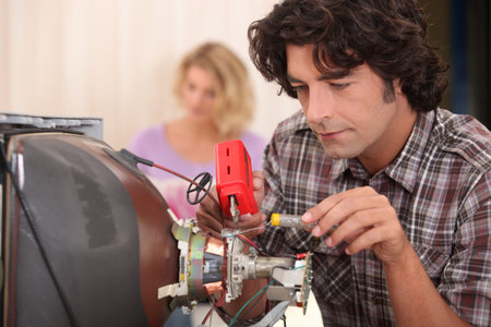 Fixing the TVの写真素材