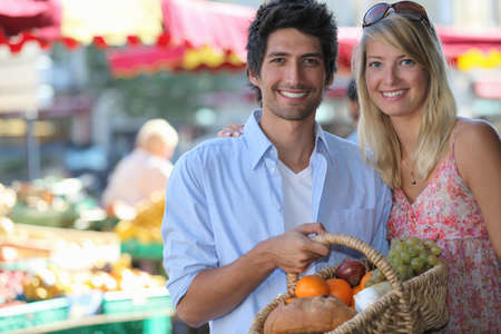 Couple shopping at local marketの写真素材