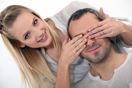 woman surprising her boyfriendの写真素材