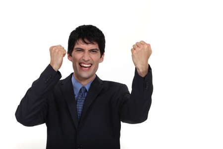 A businessman gesturing victory.の写真素材