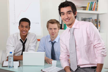 Three men in an officeの写真素材