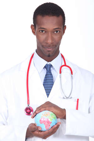 Doctor holding a globeの写真素材