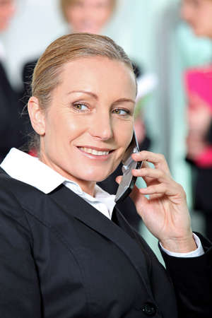 Businesswoman on the phone happy.の写真素材
