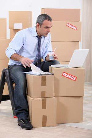single man moving into a new apartmentの写真素材