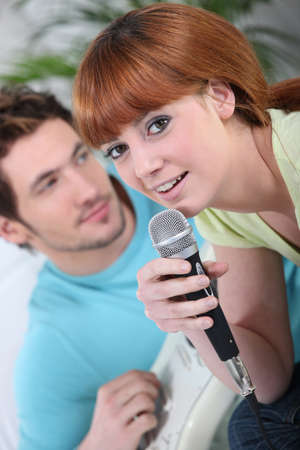 Couple singing karaokeの写真素材