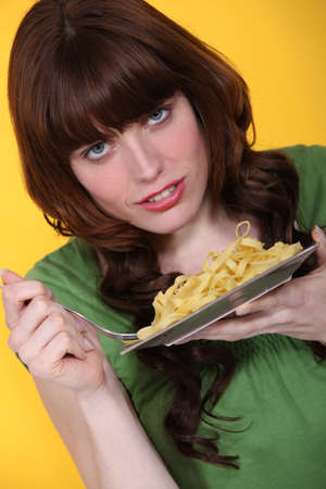 Woman eating dinnerの写真素材
