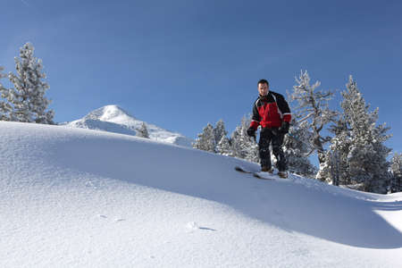 Male skier on a ski slopeの写真素材