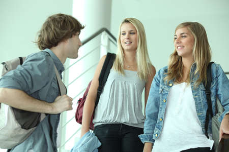 teenagers talking in stairsの写真素材