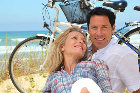 Couple relaxing by the seasideの写真素材