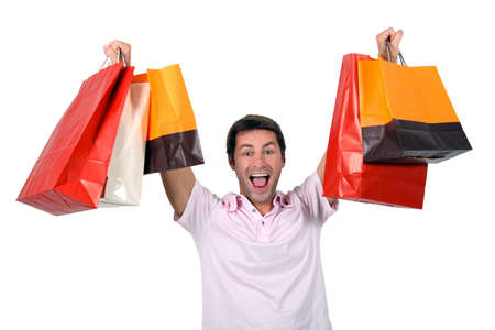 Man holding up shopping bagsの写真素材