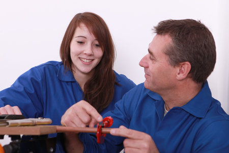 young female apprentice and instructor