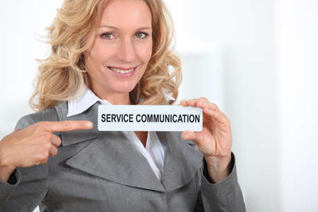 businesswoman with signの写真素材