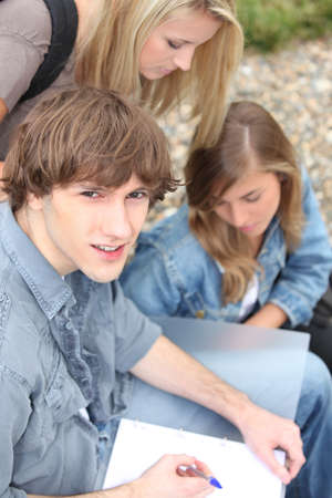 Young students outside with courseworkの写真素材