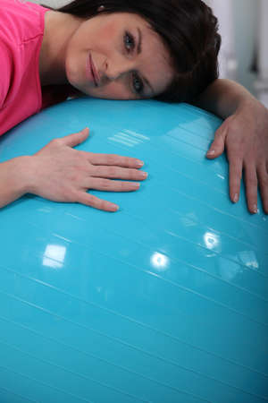 Woman with an exercise ballの写真素材