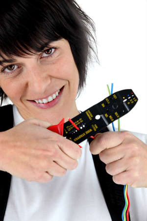 Woman with a wire stripperの写真素材