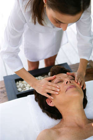 Woman receiving a massage at the spaの写真素材