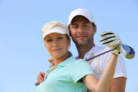 Couple playing golfの写真素材