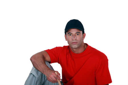 Portrait of a man with cap, studio shotの写真素材