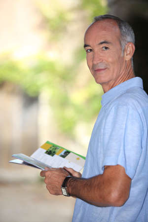 senior reading brochureの写真素材