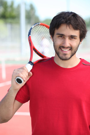 Tennis player holding racketの写真素材