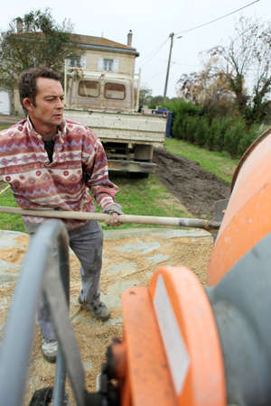Man with a cement mixerの写真素材
