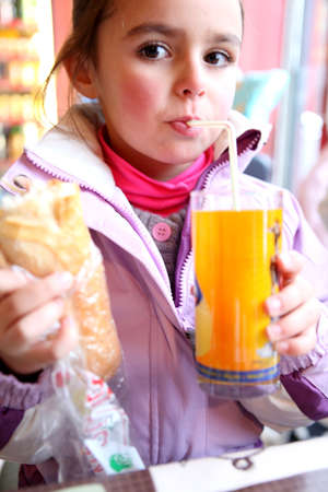 Little girl eating her lunchの写真素材
