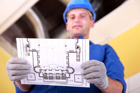 Laborer reading planの写真素材