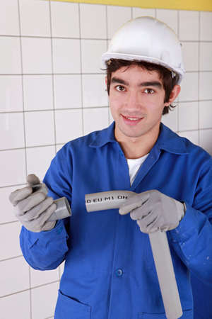 portrait of young apprentice handling u turnの写真素材