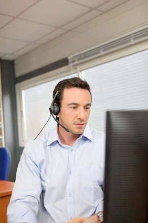 Office worker wearing a headsetの写真素材