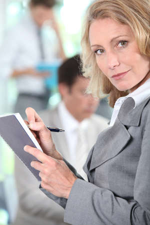 Businesswoman writingの写真素材