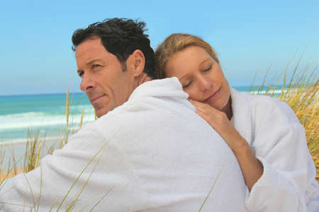 Couple relaxing on the beachの写真素材