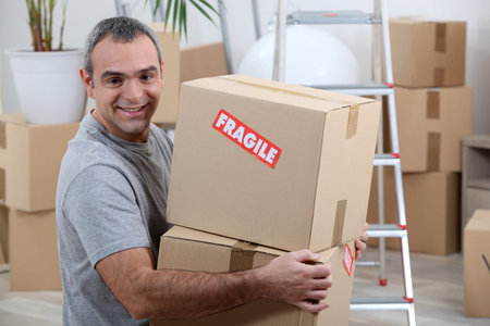 portrait of a man with cardoard boxes