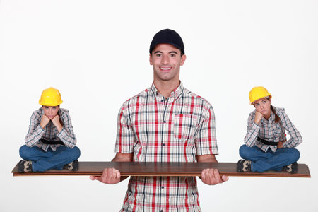 Construction manager balancing disgruntled staff