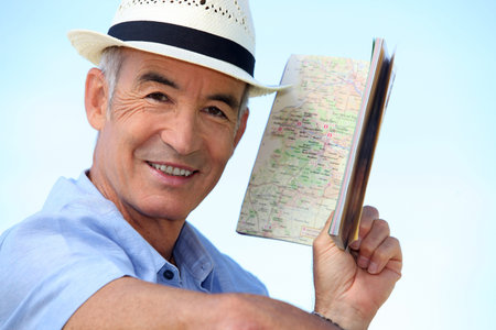 Man looking at an atlas