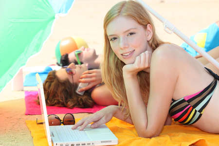 Teenagers at the beachの写真素材