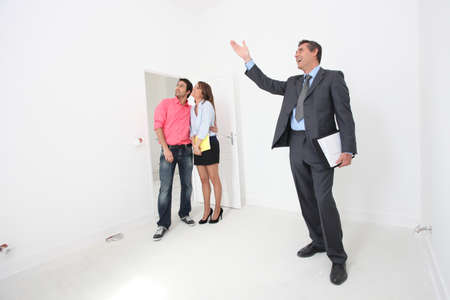 Couple being shown around property by estate-agentの写真素材