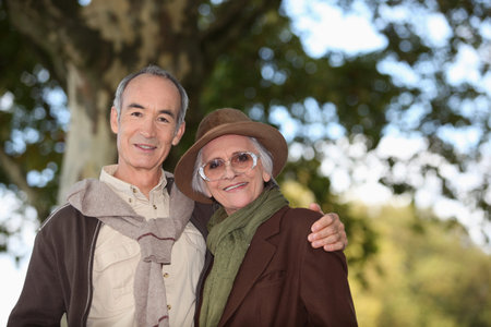Elderly couple taking a walk together in the forest