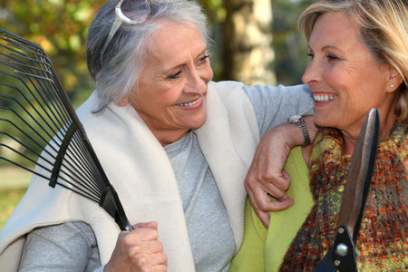 two senior friends gardeningの写真素材