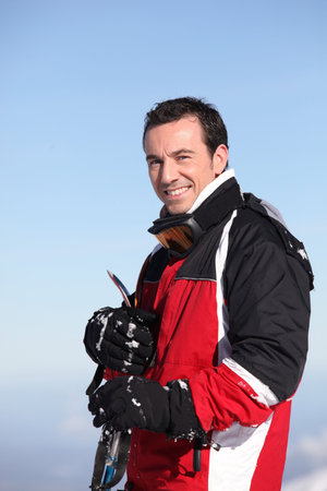 Portrait of a smiling male skierの写真素材