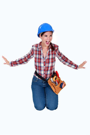 An angry female construction worker.の写真素材