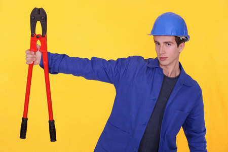 craftsman holding a huge spanner
