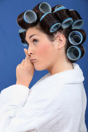 Woman with her hair in rollersの写真素材