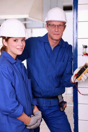 Young female apprentice electricianの写真素材