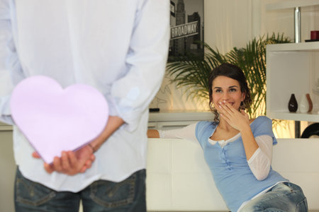 Man holding hear-shaped gift