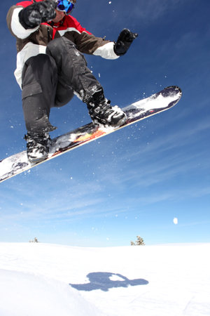 Snowboarder gliding through the air