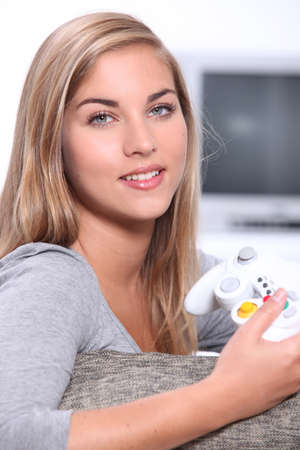 Teenage girl playing computer gamesの写真素材