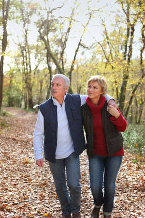 Couple taking romantic stroll in the parkの写真素材
