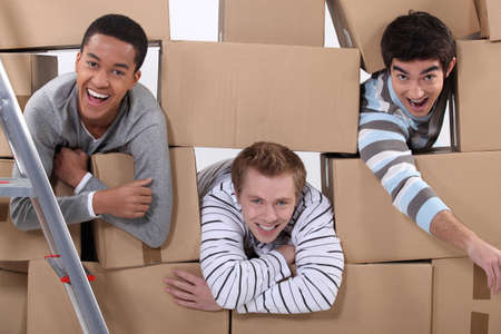 Three men moving houseの写真素材