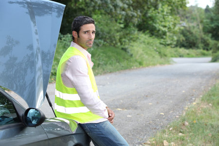 Man waiting for roadside assistance