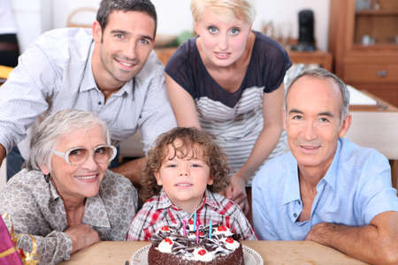 Family celebrating a birthday togetherの写真素材